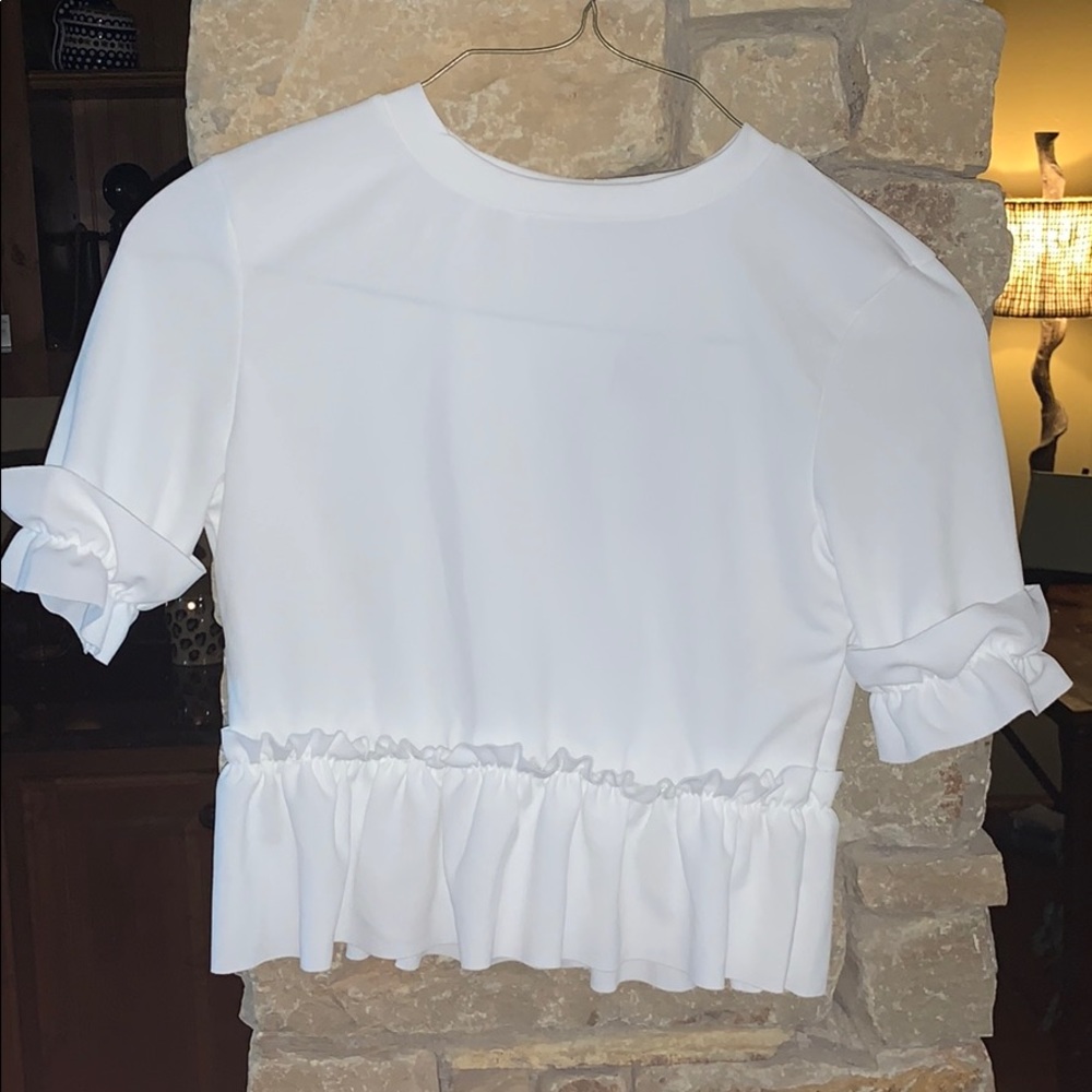 White mid length ruffle hem top